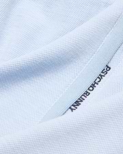 Light blue pique knit Kids Keith Short, showcasing premium streetwear with dark blue embroidered PSYCHO BUNNY text on a subtle lighter blue trim. (6)