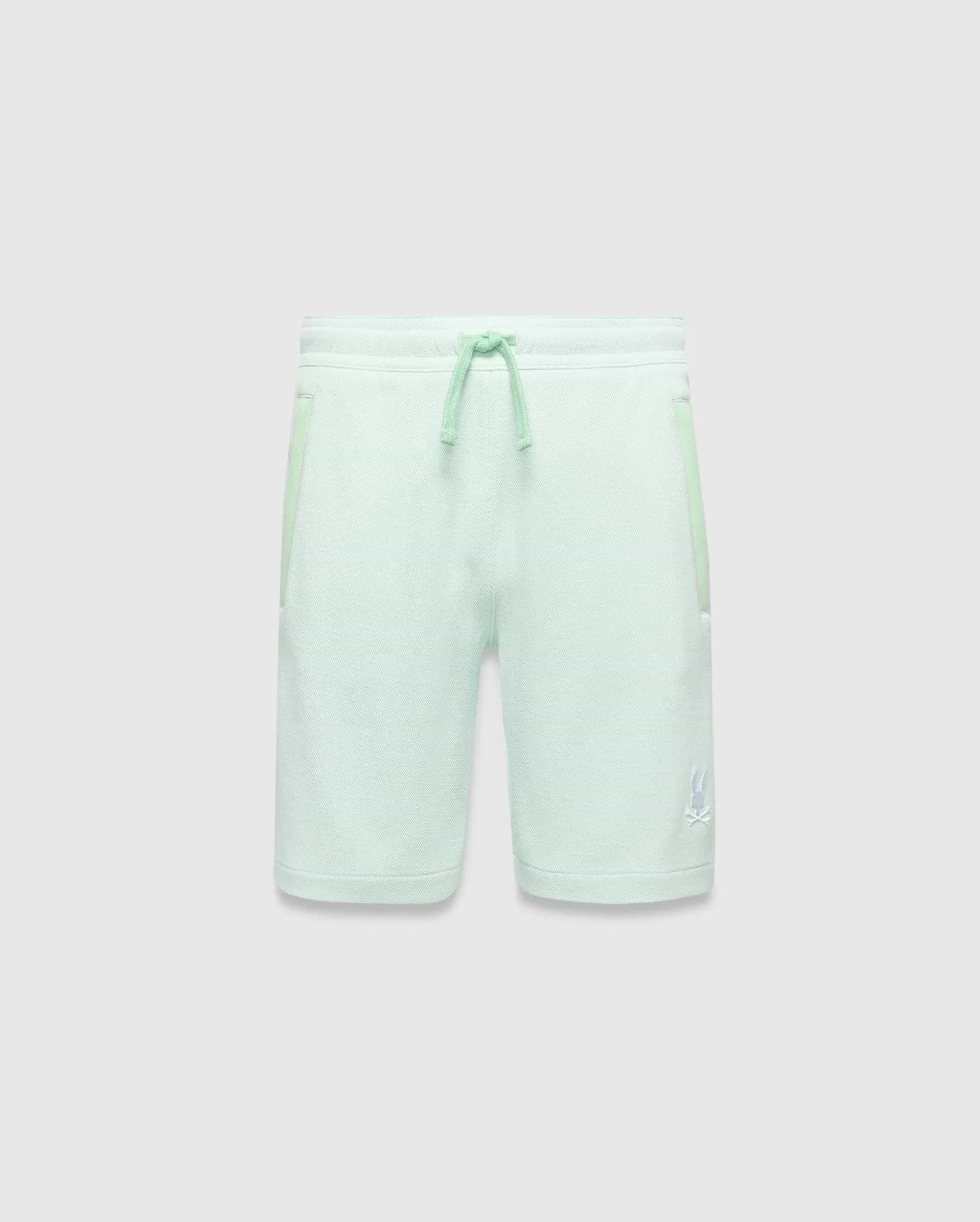 Kids Keith Short in mint green jersey knit, featuring a relaxed fit, lighter mint drawstrings, side pockets with subtle accent trim, and a small white embroidered Psycho Bunny skull logo on the lower left leg. (4)