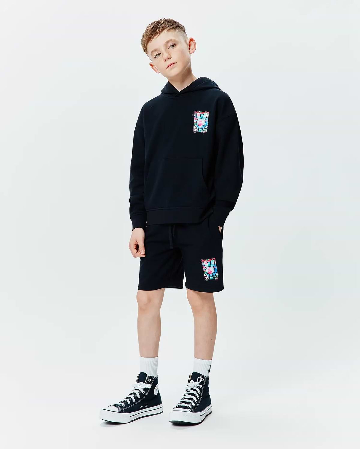 Black relaxed fit French terry hoodie with a vibrant multi-color Psycho Bunny skull graphic on the left chest, paired with matching Kids Isaac Print Short featuring the same graphic on the left leg and a drawstring waist.