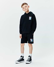 Black relaxed fit French terry hoodie with a vibrant multi-color Psycho Bunny skull graphic on the left chest, paired with matching Kids Isaac Print Short featuring the same graphic on the left leg and a drawstring waist.