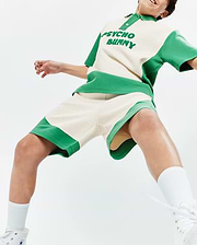 Cream and vibrant green color-blocked Psycho Bunny polo shirt, featuring a large embroidered chest logo, paired with matching relaxed-fit Kids Kelly Short in soft french terry fabric.