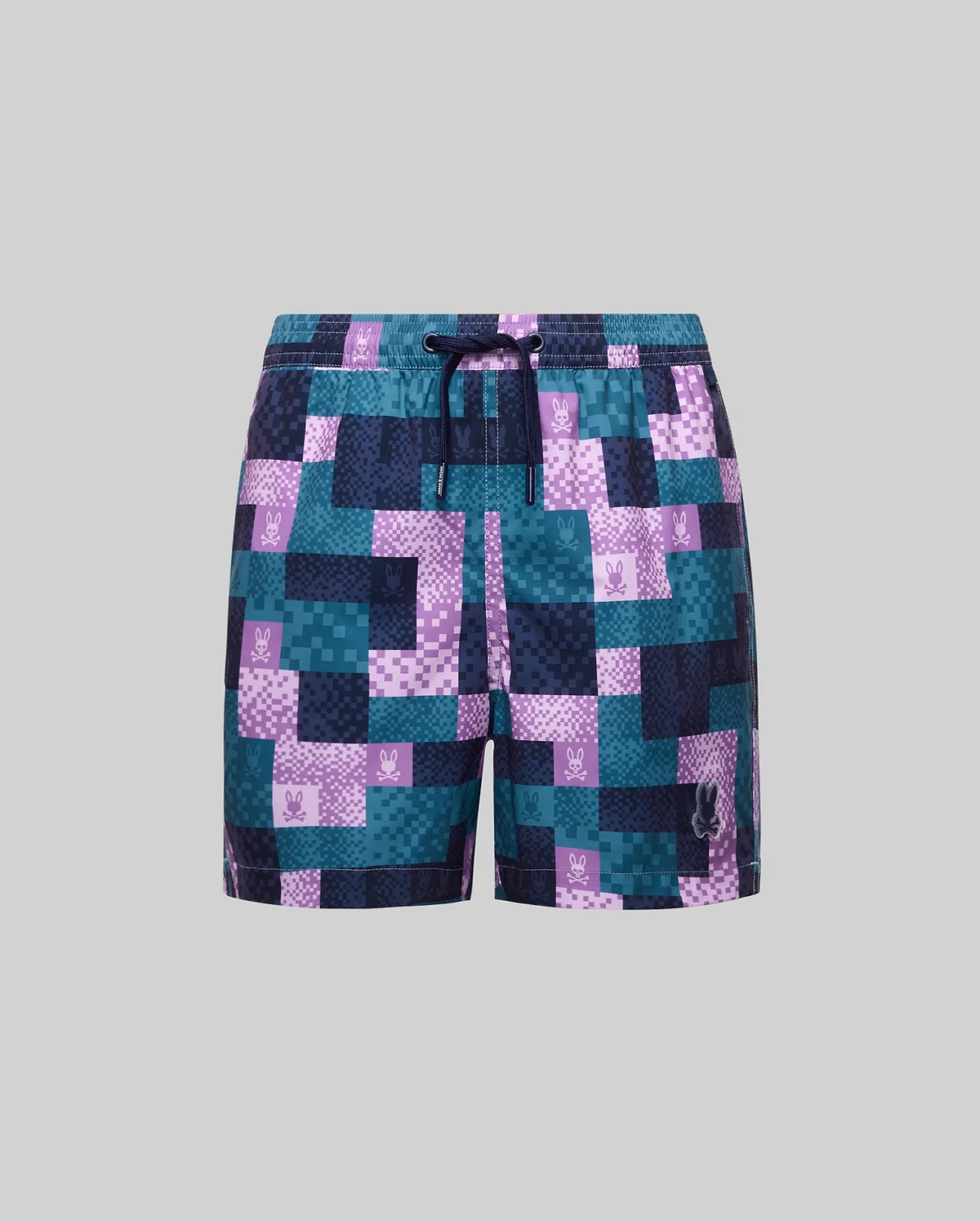 Kids Olivier All Over Bunny Swim Trunk with a pixelated teal, purple, and navy pattern, all-over bunny skull logo print, drawstring waist, and a larger embroidered logo.