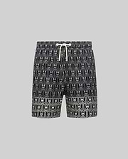 Kids Keon Swim Trunk in black, featuring a bold all-over white Psycho Bunny skull logo grid pattern and a contrasting white drawstring. This relaxed-fit swim trunk is designed for comfort. (5)