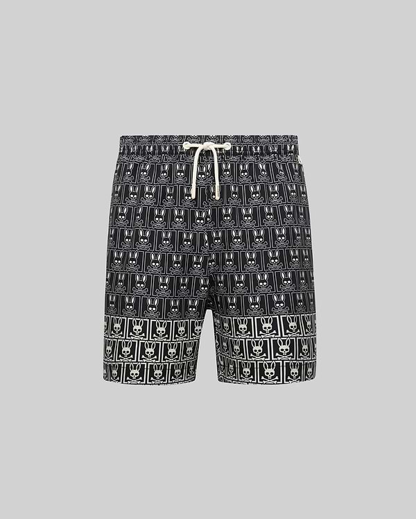Kids Keon Swim Trunk in black, featuring a bold all-over white Psycho Bunny skull logo grid pattern and a contrasting white drawstring. This relaxed-fit swim trunk is designed for comfort. (5)