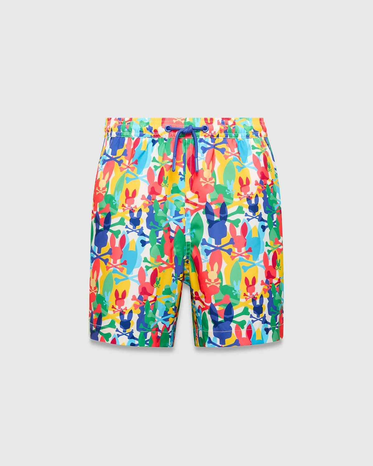 Kids Tanner Swim Trunk with a vibrant all-over print of colorful Psycho Bunny skull logos, crossbones, and surfboards on a white background, featuring a royal blue drawstring.