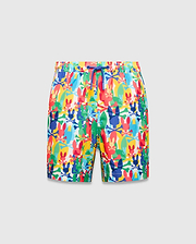 Kids Tanner Swim Trunk with a vibrant all-over print of colorful Psycho Bunny skull logos, crossbones, and surfboards on a white background, featuring a royal blue drawstring.