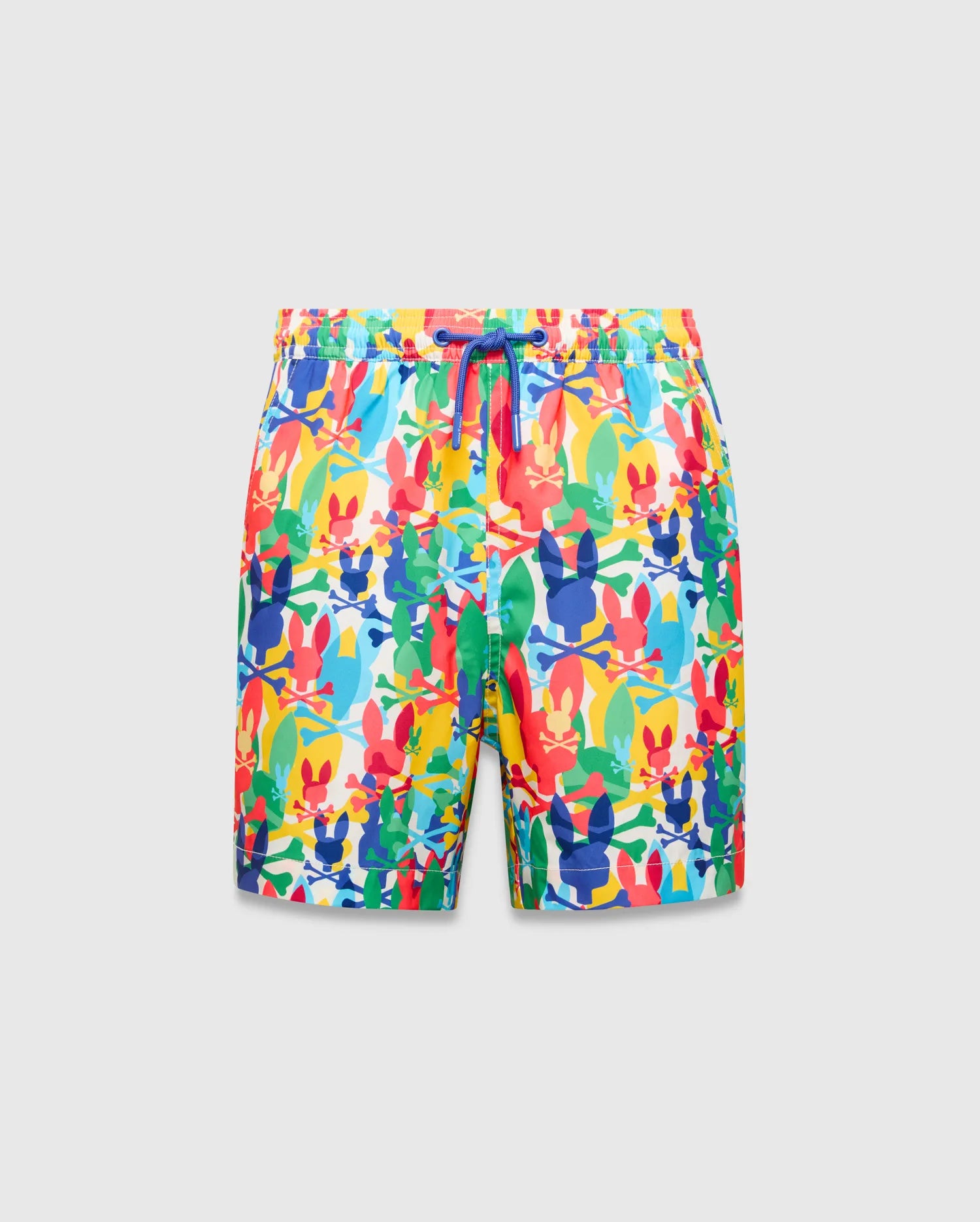 Kids Tanner Swim Trunk with a vibrant all-over print of colorful Psycho Bunny skull logos, crossbones, and surfboards on a white background, featuring a royal blue drawstring.