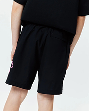 Kids Duncan Bunny Print Swim Trunk, black, featuring a large pink stylized bunny graphic on the left leg, a relaxed fit, and smooth quick-dry swim fabric.