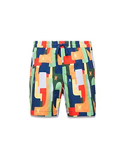 Kids Wes All Over Print Swim Trunk featuring a vibrant multi-color geometric pattern in navy, orange, red, green, and yellow, with small repeated Psycho Bunny skull logos and a blue drawstring.