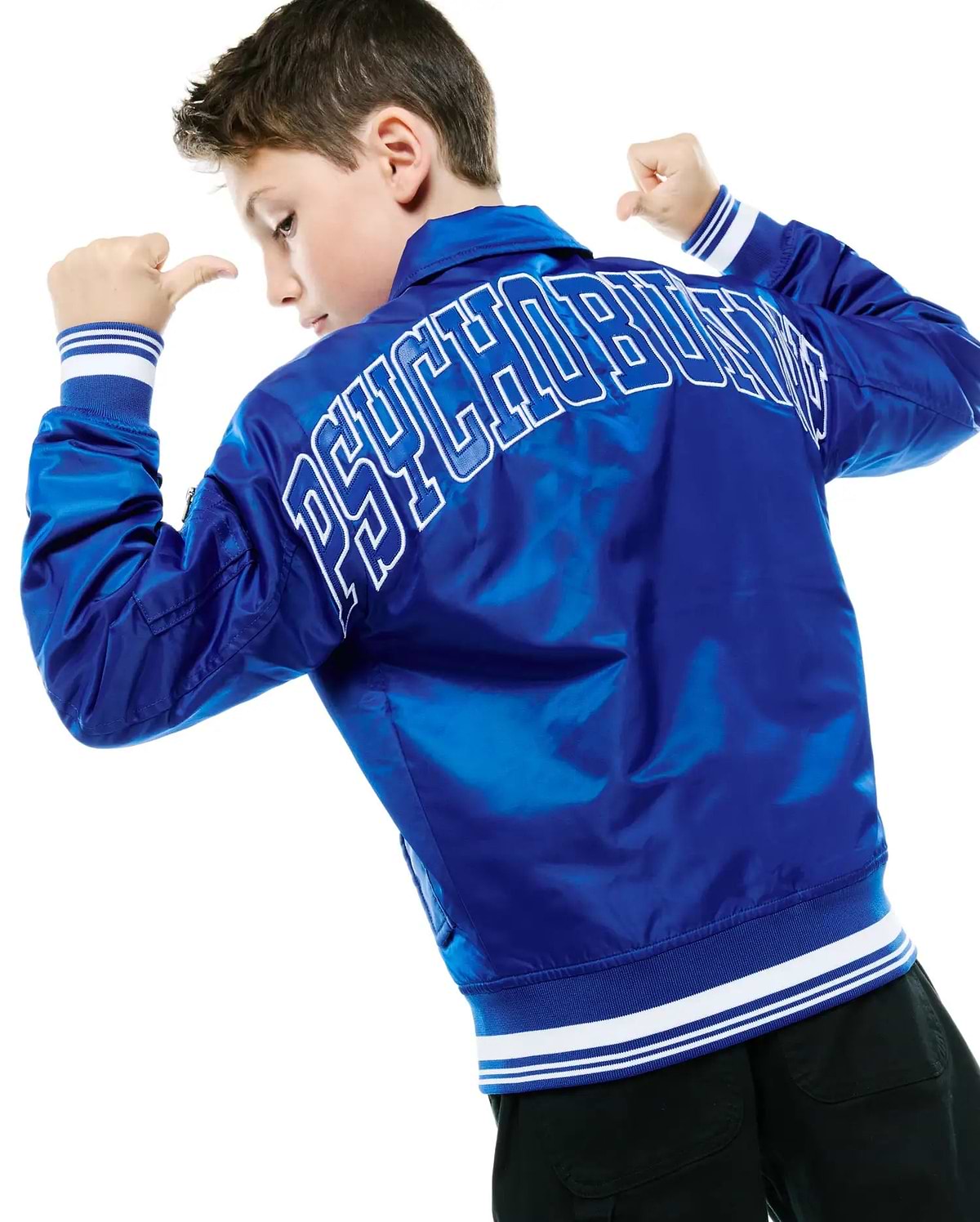 Kids Nathaniel Satin Coach Jacket in royal blue satin, featuring a large white outlined PSYCHOBUNNY text logo on the back, ribbed cuffs and hem with white stripes, and a utility sleeve pocket.