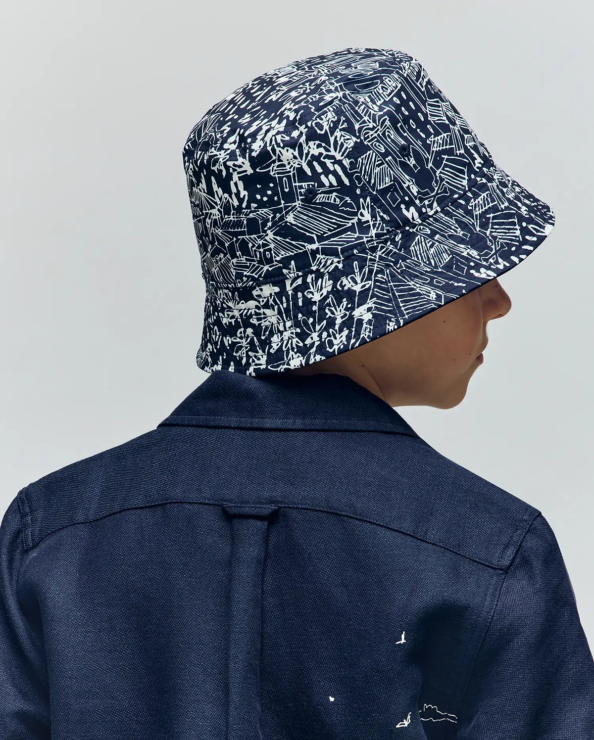 Kids Blue Naxos Reversible Bucket Hat | Psycho Bunny