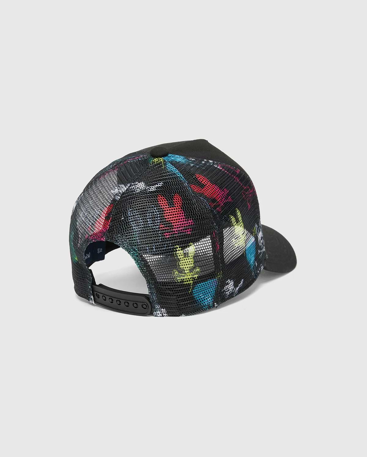 KIDS QUINTIN TRUCKER CAP. Black mesh trucker cap featuring a vibrant, repeating multi-color iconic Psycho Bunny skull print on the front panels, complete with a black adjustable snapback closure.