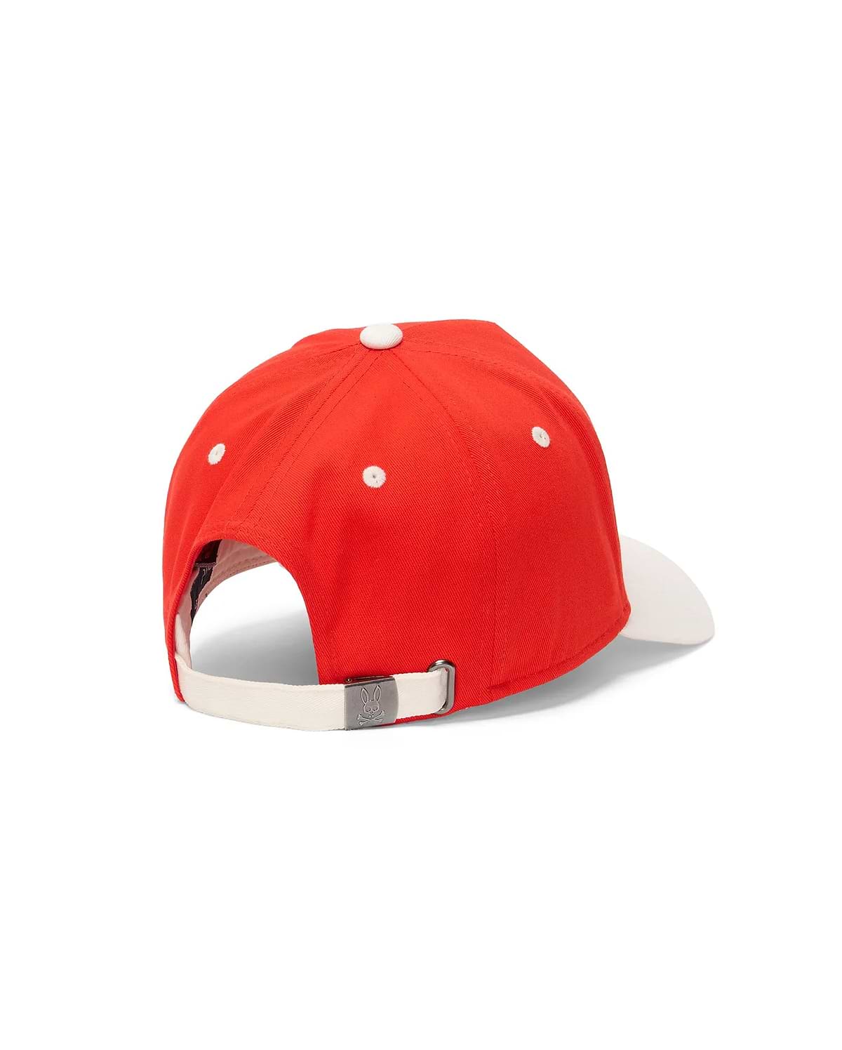 Kids Sable A-Frame Trucker Cap in vibrant red with a white brim, top button, and eyelets. Features a cream adjustable back strap with a small metal Psycho Bunny skull logo buckle.