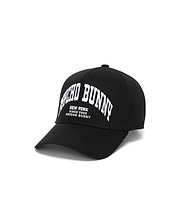 Black Kids Nathaniel A-Frame Trucker Cap with bold white arched embroidered Psycho Bunny New York Since 2005 text prominently on the front, showcasing premium streetwear style.
