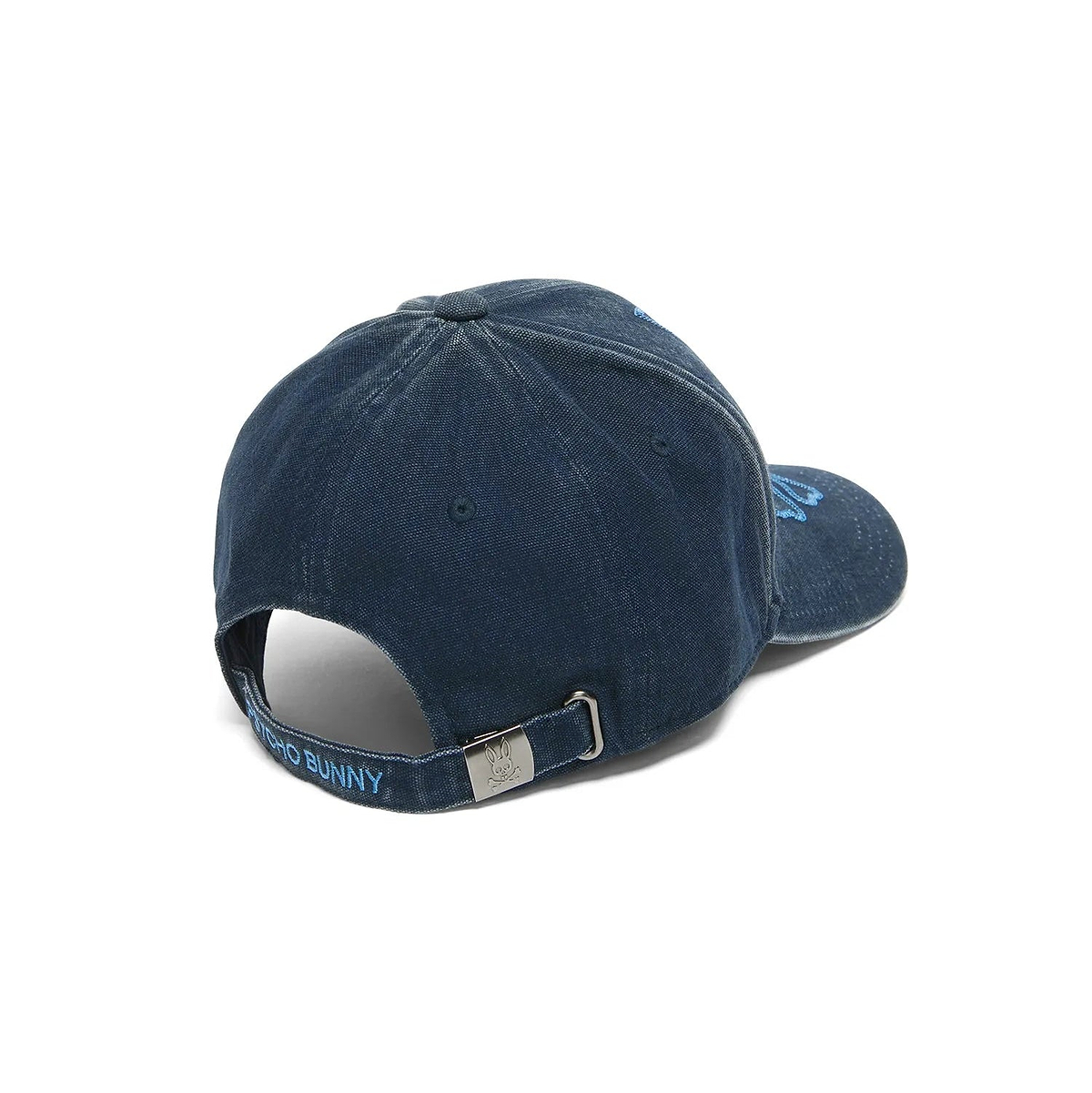 KIDS' GROVER BASEBALL CAP in navy washed denim with light blue embroidered Psycho Bunny skull logo on front, Psycho Bunny text on back strap, and engraved logo buckle. (4)
