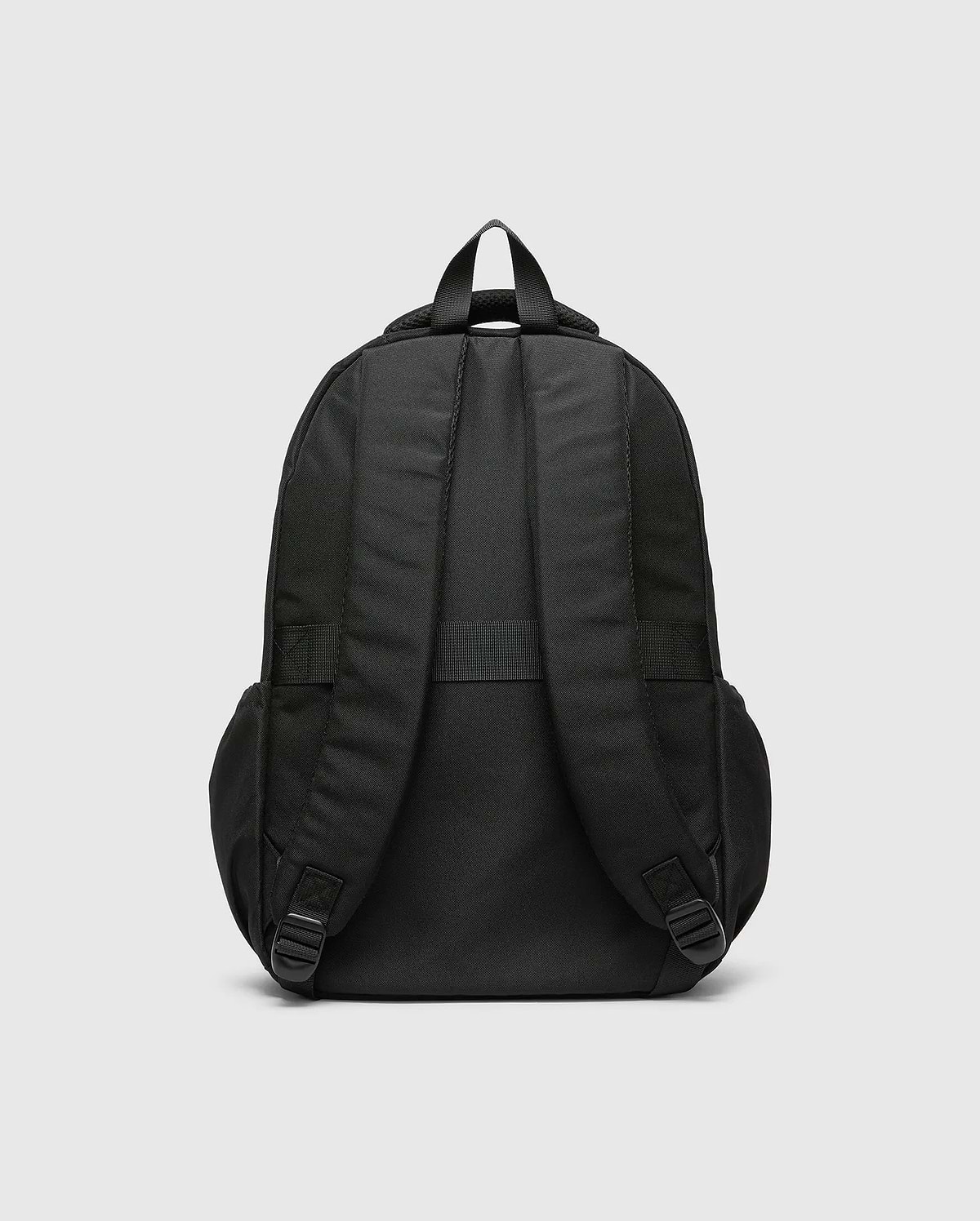 Psycho Bunny Kids Pal Backpack in black, featuring padded shoulder straps, a top carry handle, and adjustable bottom straps, crafted from durable fabric.