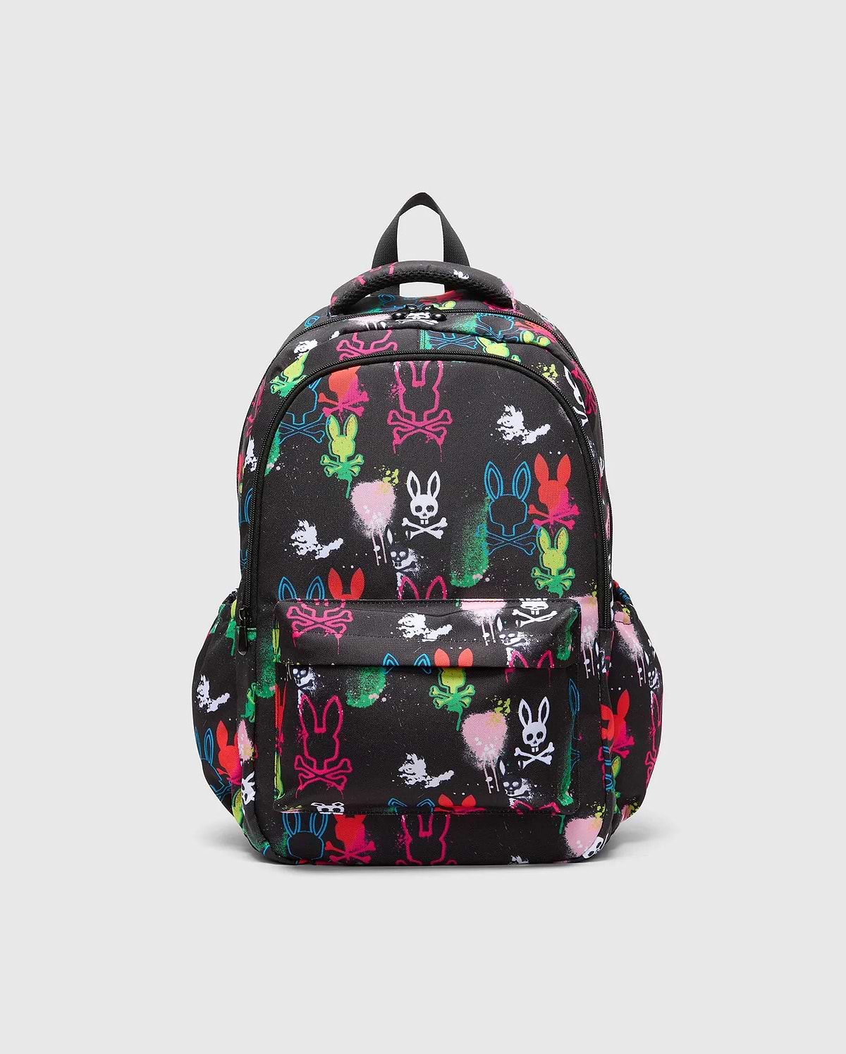Kids Quintin Backpack, black durable woven fabric with an all-over vibrant neon graffiti print featuring multiple Psycho Bunny skull logos and paint splatters, front zip pocket.
