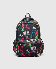 Kids Quintin Backpack, black durable woven fabric with an all-over vibrant neon graffiti print featuring multiple Psycho Bunny skull logos and paint splatters, front zip pocket.
