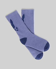 A pair from the KIDS 3 PACK SPORT SOCK - KO2200005 by Psycho Bunny in light purple cotton features dark blue heels, toes, and a bunny silhouette on each side. The socks are displayed flat on a light gray background.