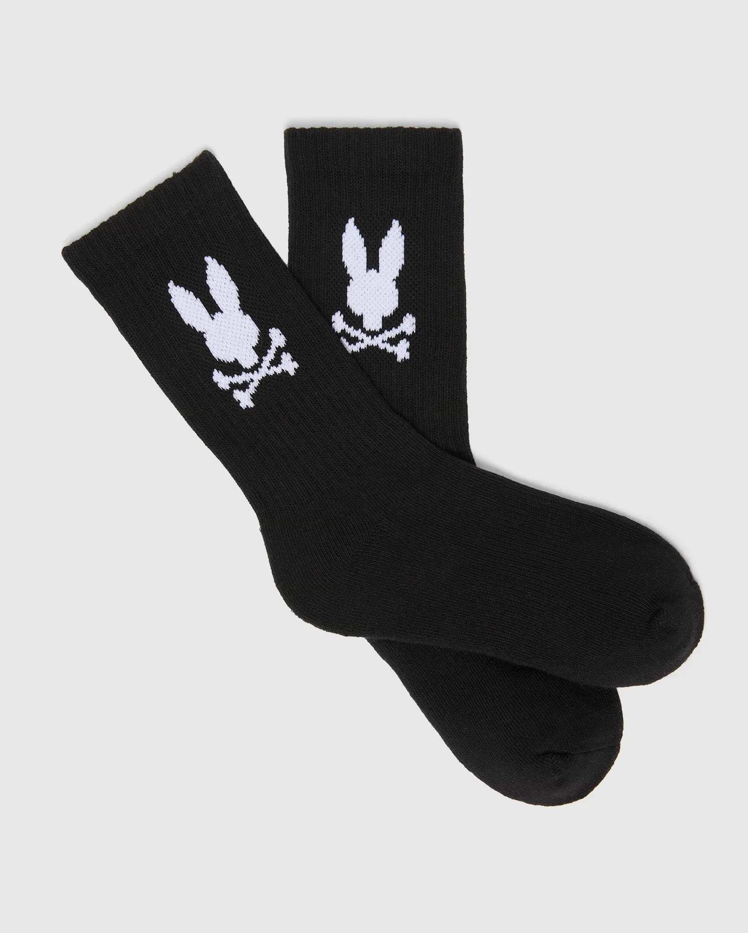 Kids 3 Pack Sport Socks, black knit with a comfortable ribbed cuff, prominently featuring the large white Psycho Bunny skull and crossbones logo on each ankle.