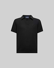 Kids Devon Knit Polo, black textured knit with a V-neck collar, classic fit, and a small tonal embroidered Psycho Bunny skull logo on the left chest.