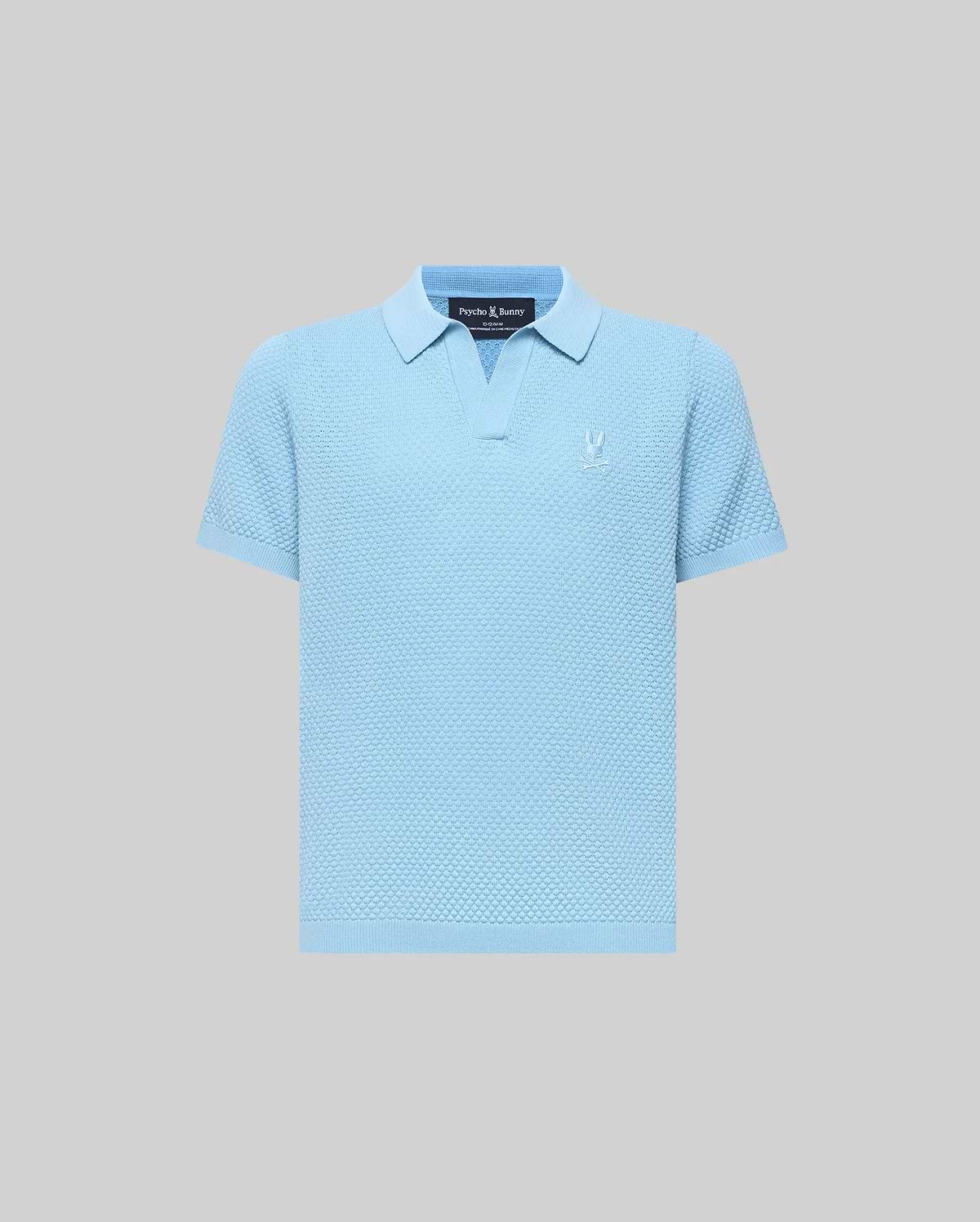 Kids Devon Bubble Stitch Knit Polo in light blue, featuring a textured bubble stitch knit fabric, an open placket, and a small, tonal embroidered Psycho Bunny skull logo on the left chest.