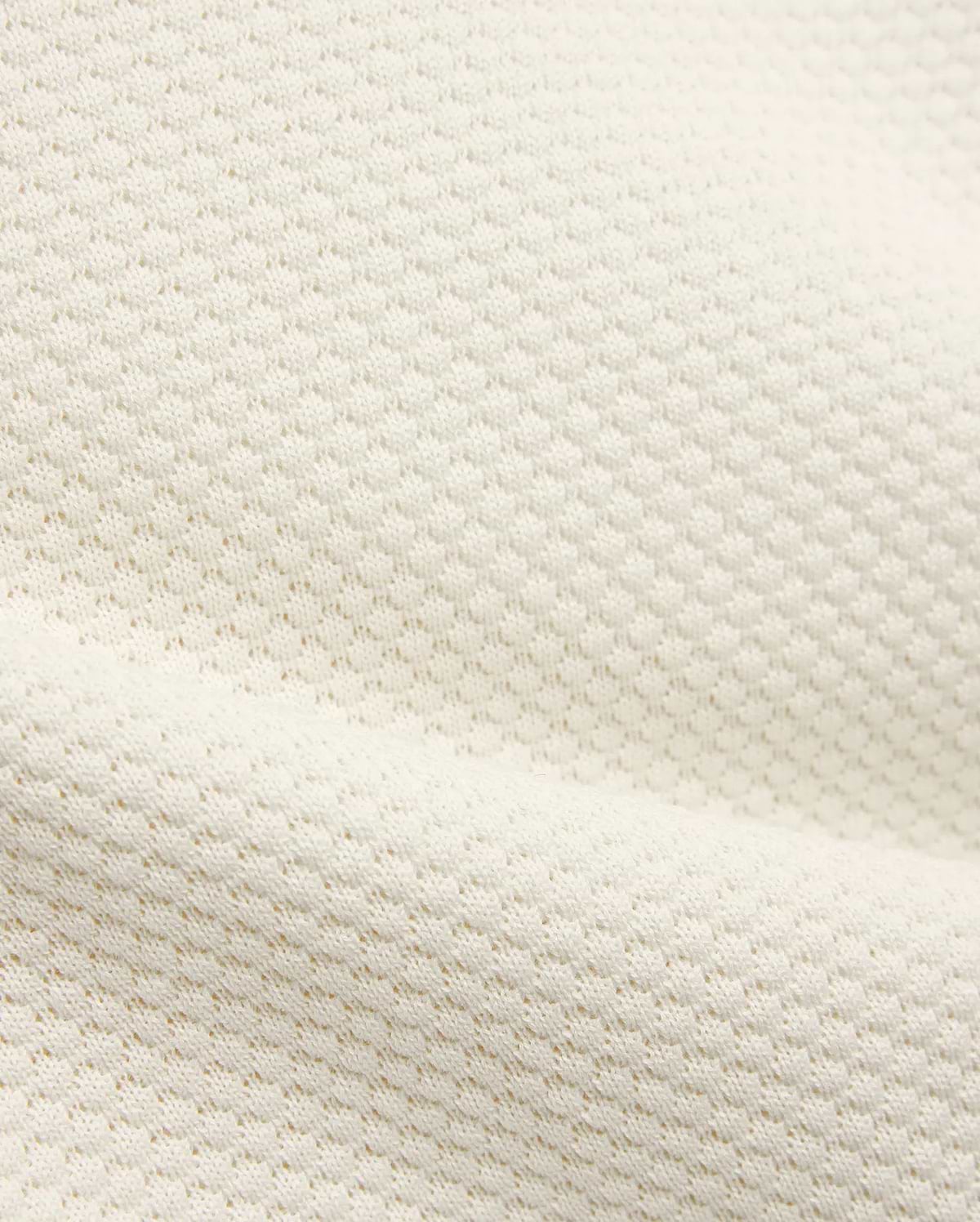 Kids Devon Knit Polo in creamy off-white, featuring a refined textured knit fabric with a subtle, breathable pique-like pattern, perfect for premium streetwear.