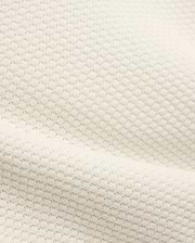 Kids Devon Knit Polo in creamy off-white, featuring a refined textured knit fabric with a subtle, breathable pique-like pattern, perfect for premium streetwear.