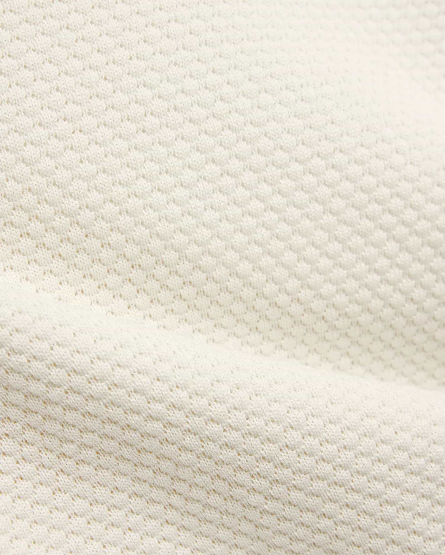 Kids Devon Knit Polo in creamy off-white, featuring a refined textured knit fabric with a subtle, breathable pique-like pattern, perfect for premium streetwear.