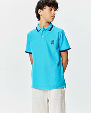 Kids Holden Pique Polo in vibrant blue, featuring a classic fit, pique texture, navy ribbed collar and cuffs, and a small embroidered Psycho Bunny skull logo on the left chest.