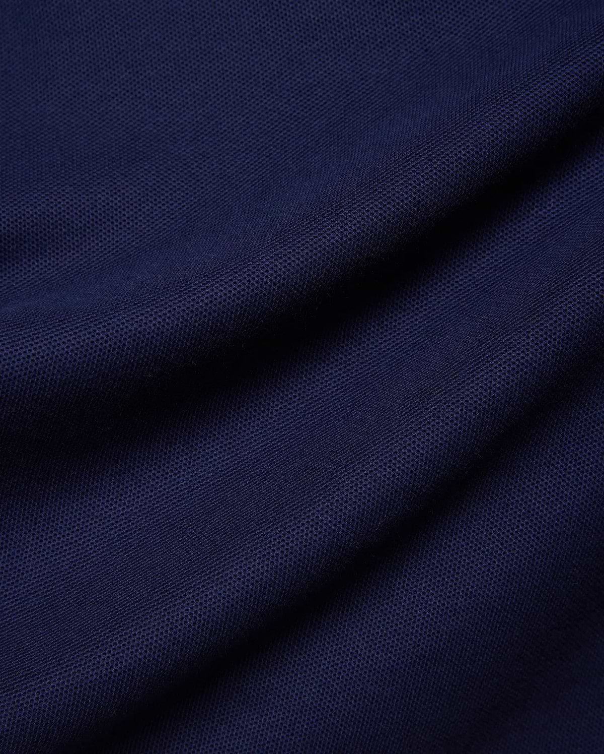 Kids Holden Pique Polo in rich navy blue, a classic fit polo crafted from breathable pique fabric, featuring the iconic embroidered Psycho Bunny skull logo on the left chest.