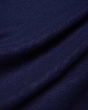 Kids Holden Pique Polo in rich navy blue, a classic fit polo crafted from breathable pique fabric, featuring the iconic embroidered Psycho Bunny skull logo on the left chest.