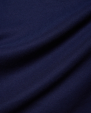 Kids Holden Pique Polo in rich navy blue, a classic fit polo crafted from breathable pique fabric, featuring the iconic embroidered Psycho Bunny skull logo on the left chest.