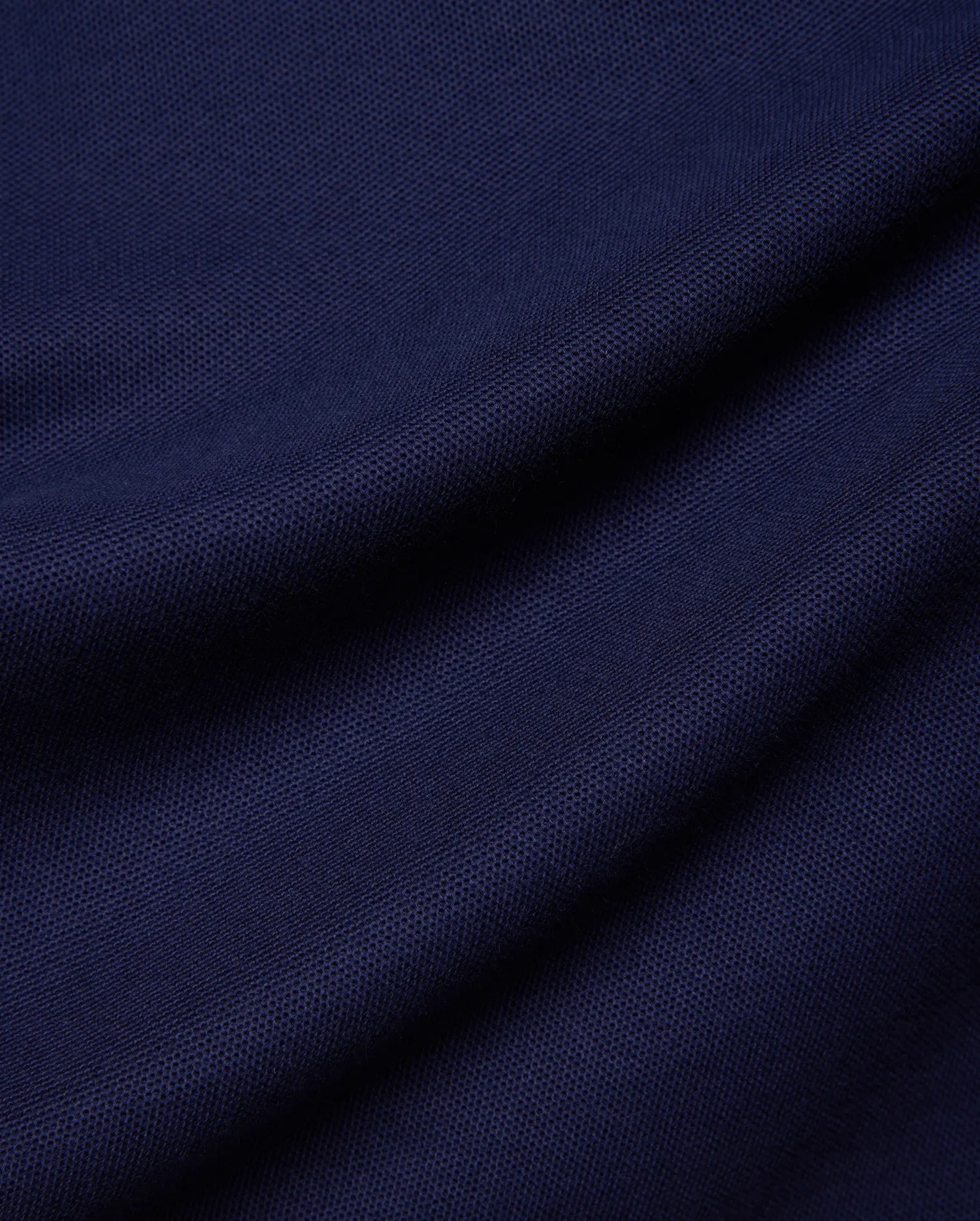 Kids Holden Pique Polo in rich navy blue, a classic fit polo crafted from breathable pique fabric, featuring the iconic embroidered Psycho Bunny skull logo on the left chest.
