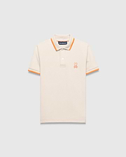 Kids Holden Pique Polo, a classic fit cream pique polo with orange striped ribbed collar and cuffs, featuring a small embroidered orange Psycho Bunny skull logo on the left chest.