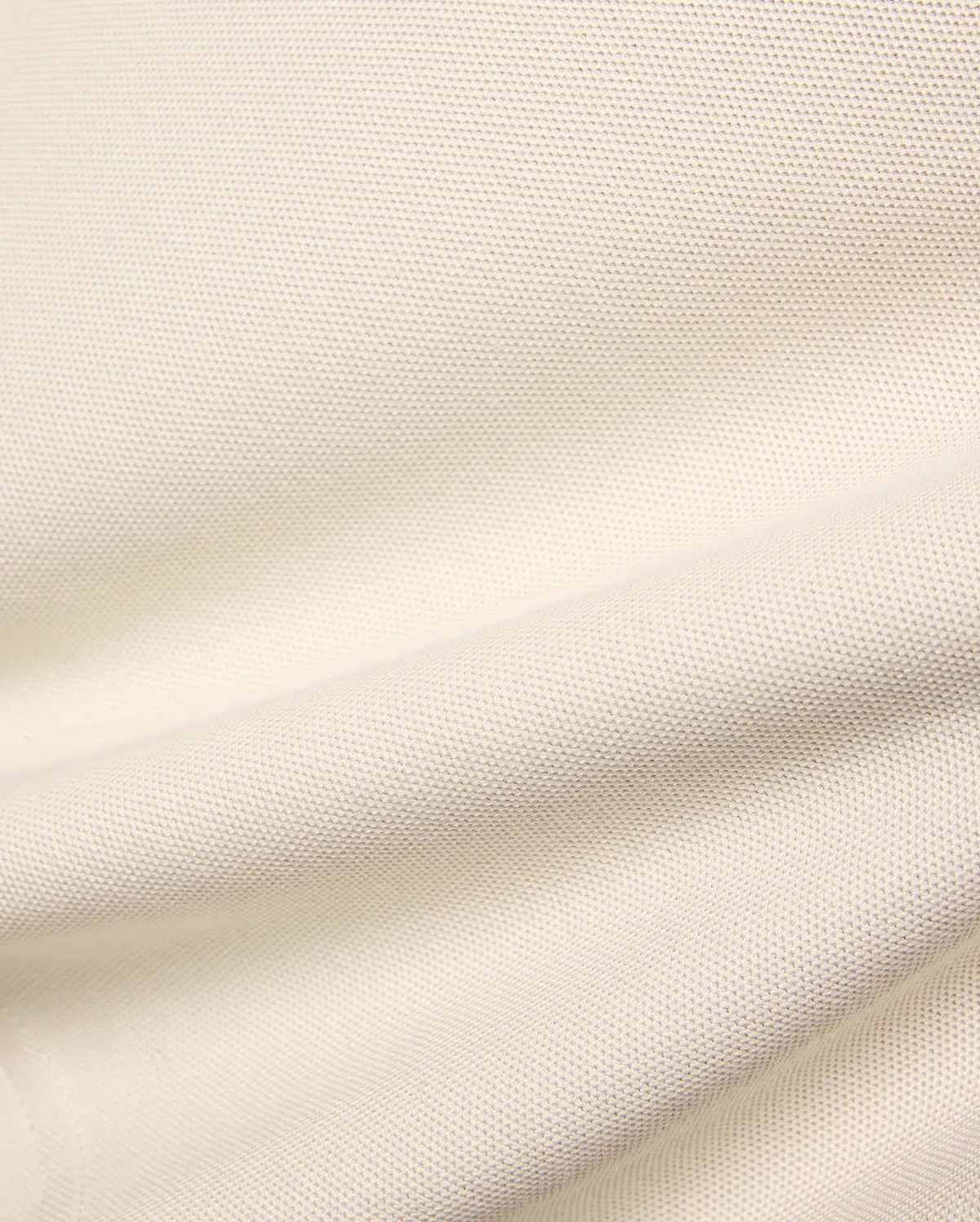 Kids Holden Pique Polo fabric swatch in a soft cream hue, showcasing the classic textured pique knit, perfect for premium menswear, refined streetwear, and comfortable, stylish apparel.