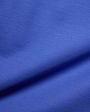 Kids Brad Pique Polo, a vibrant royal blue premium pique fabric, showcasing its distinctive textured weave, embodying Psycho Bunny's bold, refined streetwear aesthetic for a classic fit.