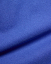 Kids Brad Pique Polo, a vibrant royal blue premium pique fabric, showcasing its distinctive textured weave, embodying Psycho Bunny's bold, refined streetwear aesthetic for a classic fit.