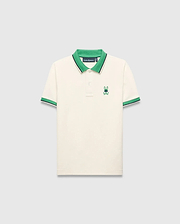 Kids Sunny Pique Polo in cream pique, classic fit, with a vibrant green collar, green and navy striped cuffs, and an embroidered green and blue Psycho Bunny skull logo on the left chest.
