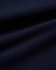 KIDS JAYDON PIQUE POLO in a deep, luxurious navy blue, showcasing the intricate, breathable texture of its premium pique knit fabric, a hallmark of Psycho Bunny's refined quality.