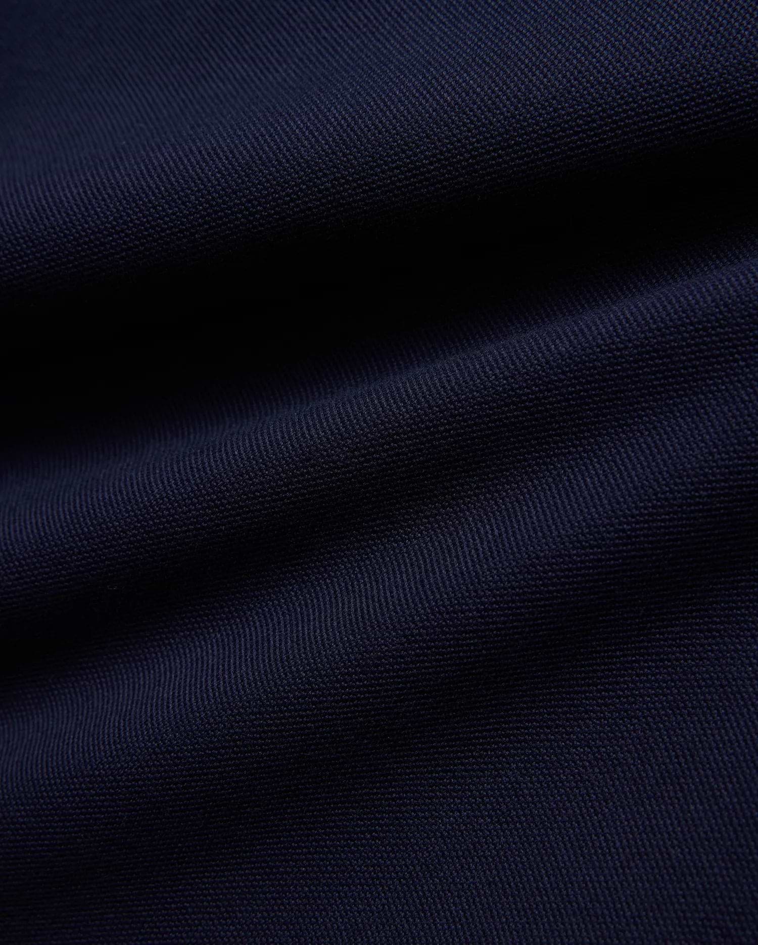 KIDS JAYDON PIQUE POLO in a deep, luxurious navy blue, showcasing the intricate, breathable texture of its premium pique knit fabric, a hallmark of Psycho Bunny's refined quality.