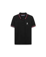 Kids Jaydon Pique Polo, black classic fit pique polo with red and white striped collar and cuffs, featuring a small embroidered Psycho Bunny skull logo on the left chest.