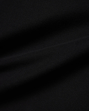 Kids Jaydon Pique Polo in deep black, showcasing its premium textured pique fabric, designed for a classic fit, and featuring the signature small embroidered Psycho Bunny skull logo on the left chest.