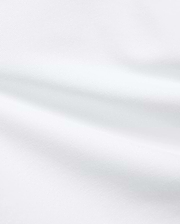Premium White Kids Jaydon Pique Polo fabric, a detailed close-up revealing the refined, textured pique weave and elegant, subtle folds, reflecting the brand's quality.