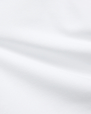 Premium White Kids Jaydon Pique Polo fabric, a detailed close-up revealing the refined, textured pique weave and elegant, subtle folds, reflecting the brand's quality.
