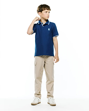Kids Stan Pique Polo in navy blue, featuring a classic fit, pique knit fabric, ribbed collar and cuffs with white double stripes, and a small embroidered white Psycho Bunny skull logo on the left chest.