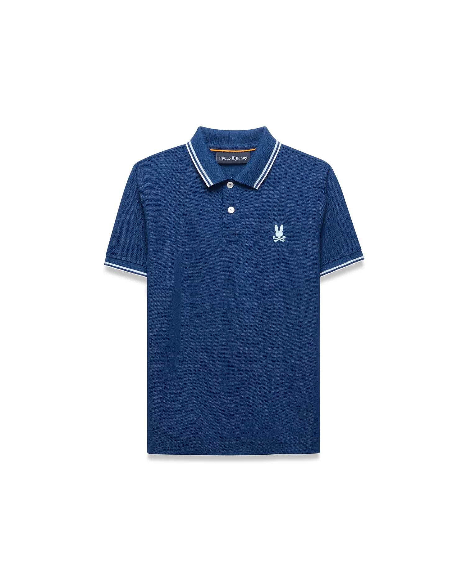 Kids Stan Pique Polo, deep blue classic fit pique knit polo with white tipped collar and cuffs, featuring a small white embroidered Psycho Bunny skull logo on the left chest and an orange inner collar stripe.
