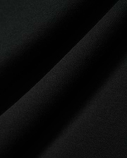 Kids Timmy Pique Polo in classic black, featuring a premium, finely textured pique knit fabric with soft, flowing folds, embodying Psycho Bunny's signature style.