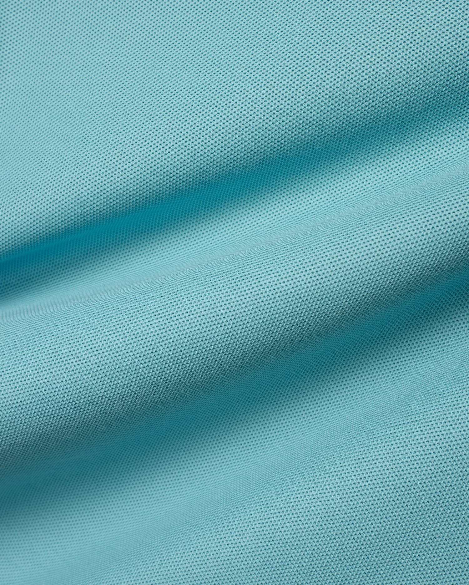 Kids' Klaus Pique Polo fabric in a vibrant aqua hue, featuring its signature textured pique weave with gentle ripples, reflecting premium Psycho Bunny quality. (6)