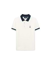 Kids' Klaus Pique Polo in cream, a classic fit pique knit shirt with a navy collar and cuffs accented by light blue stripes, featuring a small embroidered Psycho Bunny skull logo on the left chest. (5)
